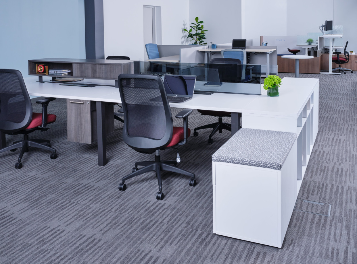 Preview of Oxygen Benching with glass screen, worksurface mounted storage, and suspended pedestal. Shown with Bolton Seating