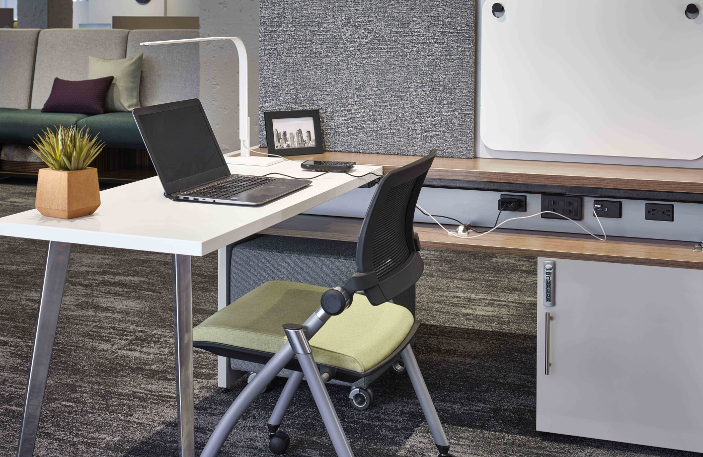 Preview of Calibrate Community with worksurface attached to glide system with flip door open to show power in beam