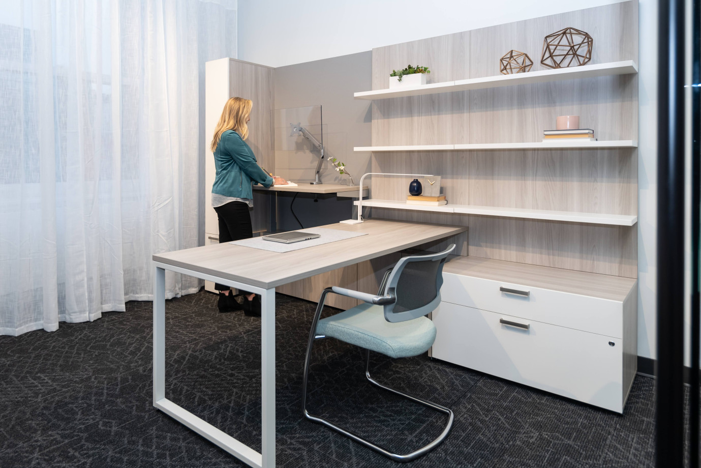 Preview of NeoCon 2021 Calibrate Casegoods Private Office with height adjustable cantilevered return and L Shelves. Shown with Devens side chair