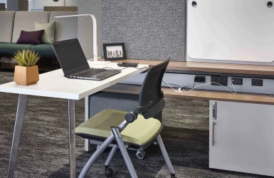 Calibrate Community with worksurface attached to glide system with flip door open to show power in beam