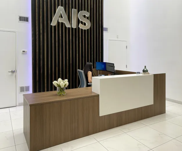AIS Headquarters Calibrate Reception Desk with Corian Stack-on