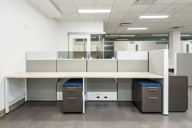 Matrix Workstations with Upmounted Grey Tint Glass, Tool Rail Inserts and L Series Pedestals Client Space